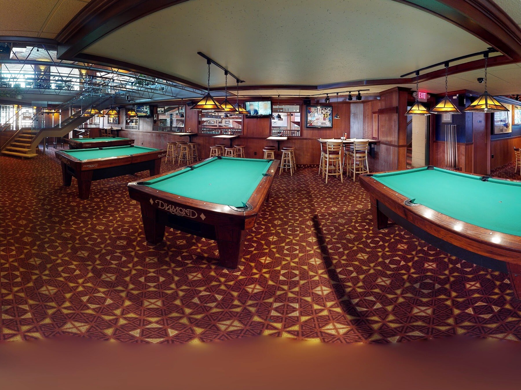 The billiard room at Andy's, lined with regulation pool tables